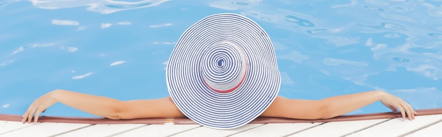 woman with hat in pool