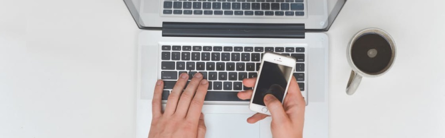 man typing on laptop